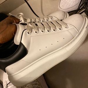 Alexander McQueens White And Black Low Top Shoes